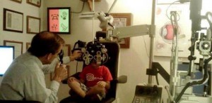 boy at optometrist exam